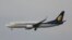 FILE - A passenger Airbus of India's Jet Airways prepares for a landing, April 16, 2015, at the Indira Gandhi International airport in New Delhi, India.