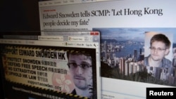An interview of Edward Snowden by the South China Morning Post newspaper (top) and a website supporting Snowden in Hong Kong, are displayed on a computer screen in Hong Kong in this June 12, 2013 illustration photo.