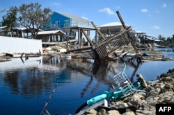 Rumah dan dermaga yang rusak terlihat setelah Badai Helene menerjang Keaton Beach, Florida, 27 September 2024. (Foto: AFP)