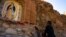 (FILE) Faithful pray at a Virgin of Guadalupe altar at Mount Cristo Rey, on the border between the United States and Mexico, in Sunland Park, New Mexico, U.S., November 23, 2024.