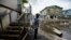 Juana Matos resident Hector Rosa walks through a flooded area after the passing of Hurricane Maria, in Puerto Rico, Wednesday, September 27, 2017. Since the devastating impact of said hurricane, the supply line of goods in general was interrupted in the US territory, causing endless rows in gas stations and comercial centers.