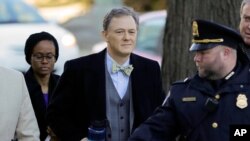 FILE - Career Foreign Service officer George Kent arrives to testify before the House Intelligence Committee on Capitol Hill in Washington, Nov. 13, 2019.