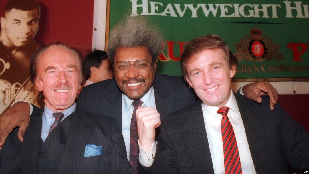 FILE - Donald Trump, right, pictured with his father, Fred Trump, left, and boxing promoter Don King participate in a news conference in Atlantic City, New Jersey, December 1987.