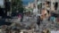 Residents evacuate Poste Marchands in Port-au-Prince, Haiti on December 9, 2024, after gangs took control of the region on December 7. Nearly 200 people in Haiti were killed in brutal weekend violence reportedly orchestrated against voodoo practitioners.