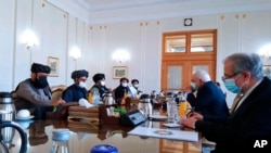 FILE - This Tasnim News Agency photo shows Iran's Foreign Minister Mohammad Javad Zarif, second right, meeting with a Taliban team in Tehran, Iran, Jan. 31, 2021.