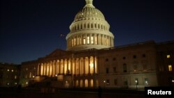 FILE - The U.S. Capitol Building is lit at sunset in Washington, Dec. 20, 2016. 