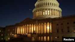 FILE - The U.S. Capitol Building is lit at sunset in Washington, Dec. 20, 2016. 