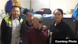 Pu Wenqing, center, mother of Chinese dissident Huang Qi, arrives in Beijing to advocate for her son in 2018.
