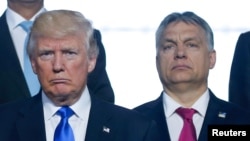 FILE - U.S. President Donald Trump and Hungarian Prime Minister Viktor Orban were part of a group photo taken during a NATO summit in Brussels, Belgium, May 25, 2017.