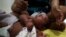 Gustavo Henrique who is 2-months old and born with microcephaly, reacts to stimulus during an evaluation session with a physiotherapist at the Altino Ventura rehabilitation center in Recife, Brazil, Feb. 11, 2016. 