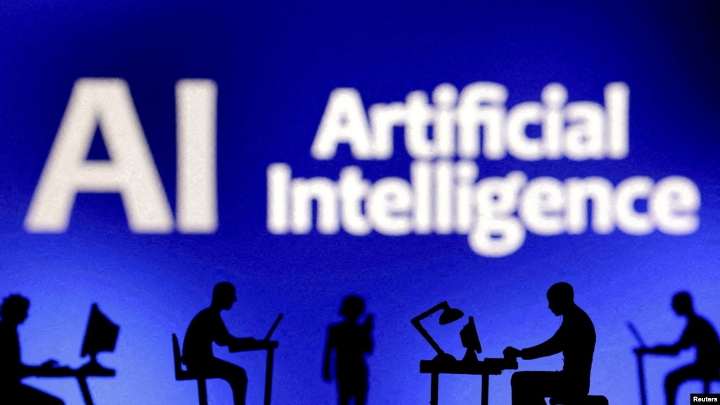 FILE - Figurines with computers and smartphones are seen in front of the words "Artificial Intelligence AI" in this illustration taken, February 19, 2024. (REUTERS/Dado Ruvic/Illustration/File Photo)