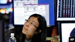 Specialist Vera Liu works on the floor of the New York Stock Exchange, Dec. 27, 2018. 