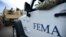 Department of Homeland Security personnel deliver supplies to Santa Ana community residents in the aftermath of Hurricane Maria in Guayama, Puerto Rico, Thursday, Oct. 5, 2017.