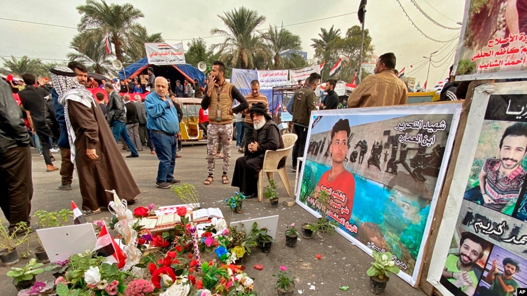 Posters of Anti-government protesters who have been killed in demonstrations are displayed in Tahrir Square during ongoing protests in Baghdad, Iraq, Dec. 12, 2019.