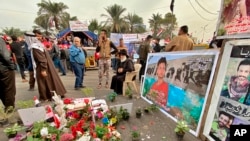 Posters of Anti-government protesters who have been killed in demonstrations are displayed in Tahrir Square during ongoing protests in Baghdad, Iraq, Dec. 12, 2019.
