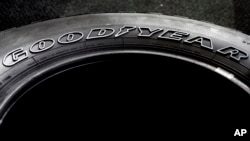 FILE - The Goodyear brand name is molded into the sidewall of a tire at a Goodyear Auto Service Center, in Stoneham, Mass.