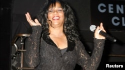 FILE - Joni Sledge, one of the original members of Sister Sledge, performs the song 'We Are Family' at the CD launch party for the 'We Are Family' CD and DVD All-Star Katrina benefit CD in Los Angeles, California, Aug. 14, 2006. 