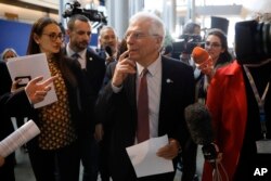 European Union foreign policy chief Josep Borrell is surrounded by reporters at the European parliament, Jan.14, 2020 in Strasbourg, eastern France.