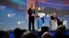 FILE - Russian President Vladimir Putin and moderator Dimitri Simes, right, attend a session of the St. Petersburg International Economic Forum in St. Petersburg, Russia, June 16, 2023. (Ramil Sitdikov/Host photo agency RIA Novosti via Reuters) 