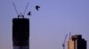 A view shows One World Trade Center (L) in New York City, April 30, 2012. The One World Trade Center, built on the Ground Zero site of the fallen World Trade Center towers, officially surpassed the Empire State Building as the tallest building in New York