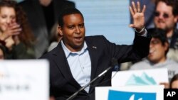 FILE - Joe Neguse, Democratic candidate for U.S. House District 2 in Colorado, greets voters before U.S. Senator Bernie Sanders speaks during a rally with young voters on the campus of the University of Colorado, Oct. 24, 2018, in Boulder, Colo. 