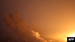 FILE - A picture taken from southern Israel near the border with the Gaza Strip on December 2, 2023, shows an explosion and smoke billowing over the Palestinian territory during an Israeli strike as battles resumed between Israel and Hamas militants.