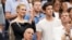 FILE - Karlie Kloss, top left, and Joshua Kushner attend the semifinals of the U.S. Open tennis tournament at the USTA Billie Jean King National Tennis Center, Sept. 6, 2018, in New York.