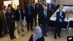 Members of the Muslim Jewish Advisory Council are welcomed to the Arab American National Museum in Dearborn, Mich., Oct. 3, 2017.