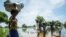 Family tries to cross flooded area after Nile river overflows in central South Sudan.