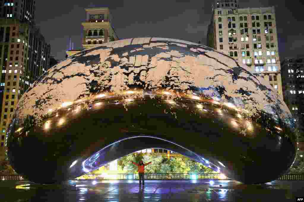 Snow on Cloud Gate (also known as The Bean) in Milennium Park in Chicago, Illinois, USA, Nov. 11, 2013. The snowfall was the first of the season for the city. 