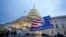 Trump supporters left a flag outside the Capitol, Jan. 6, 2021, in Washington.