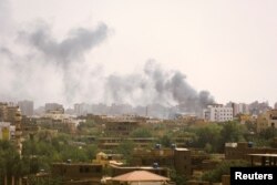 Smoke rises over buildings during clashes between the paramilitary Rapid Support Forces and the army in Khartoum