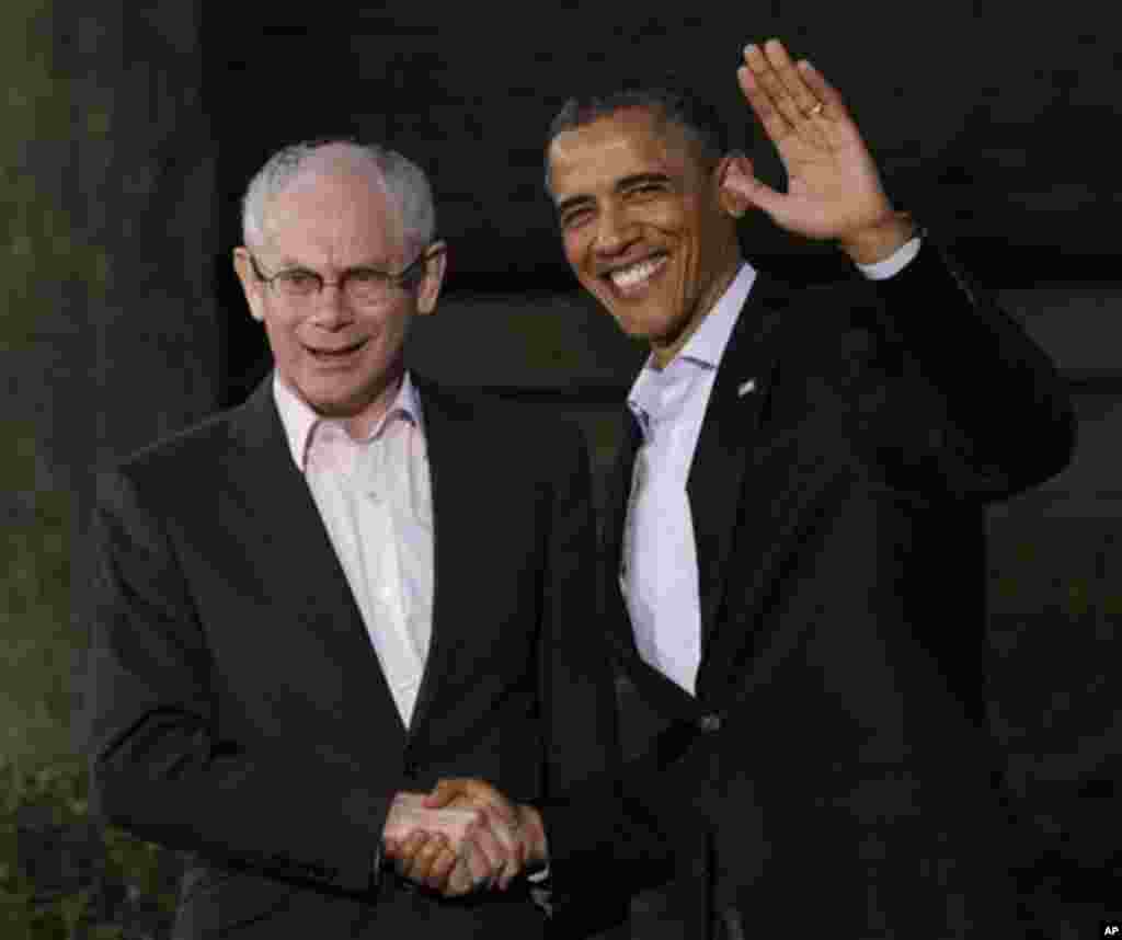President of the European Council Herman Van Rompuy, left is greeted by President Barack Obama on arrival for the G8 Summit Friday, May 18, 2012 at Camp David, Md. (AP Photo/Charles Dharapak)