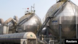 FILE - Carbon dioxide storage tanks are seen at a cement plant and carbon capture facility in Wuhu, Anhui province, China September 11, 2019