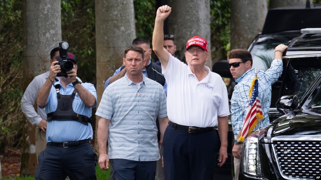 FILE - U.S. President Donald Trump gestures to supporters as he leaves the Trump International Golf Club on Feb. 17, 2025, in West Palm Beach, Florida. As Trump prepares for his annual physical exam, his main source of exercise is golf.