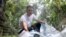 Silver craftsman, I Wayan Adi Semara Putra, 34, collects plastic waste in Gianyar, Bali, Indonesia, Dec. 22, 2021. 