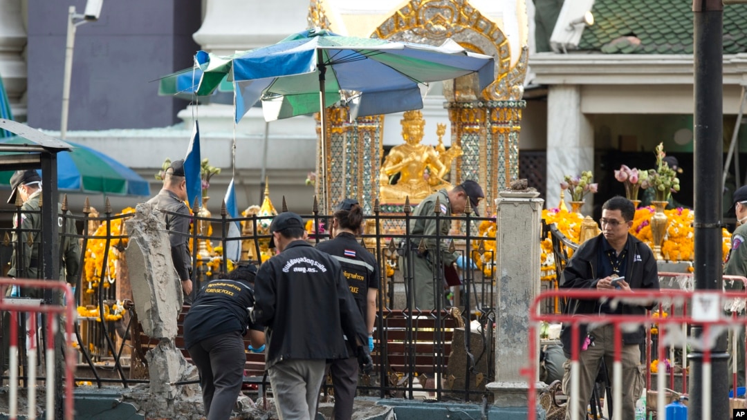 Police investigate a scene the morning after an explosion in Bangkok,Thailand, Tuesday, Aug. 18, 2015. 
