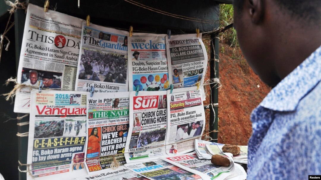 FILE - Newspapers with various front page headlines on the Chibok girls and their possible release are displayed at a news stand in Abuja, Nigeria, Oct. 18, 2014.