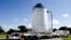 FILE - NASA's Orion spacecraft is moved toward the Payload Hazardous Servicing Facility at the Kennedy Space Center in Cape Canaveral, Florida. 