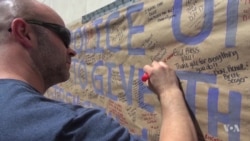 A Grieving Dallas Blankets Police Cars in Flowers, Notes