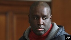 FILE - In this Nov. 13, 2015 file photo, Darius McCollum is arraigned in Brooklyn criminal court in New York. McCollum’s addiction isn’t for booze and pills - it’s for buses and trains. The notorious transit impostor who first commandeered a train at age 15 has been arrested 30 times over the years for transit-related crimes, most recently in November when he was nabbed behind the wheel of a Greyhound bus. 