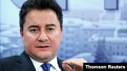 FILE - Former Turkish official Ali Babacan gestures during a meeting in Davos, Switzerland, July 11, 2019.