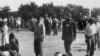 Wounded people lie in the street in Sharpeville, near Vereeniging, where at least 180 black Africans, most of them women and children, were injured and 69 killed, when South African police opened fire on black protesters, 21 Mar 1960