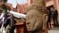 The head of Male Divinity statue is on display during a ceremony after the artifacts were returned back from Norwegian collector Morten Bosterud, at Cambodian National Museum in Phnom Penh, Cambodia, Tuesday, Oct. 20, 2015. Cambodia welcomed home two stone statue from golden Angkor era that was looted from a temple during the country's civil war and spent the past three decades in abroad. (AP Photo/Heng Sinith)