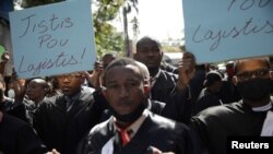 Lawyers attend a march to demand justice after the killing, on Aug. 28, of the lawyer and President of the Bar of Lawyers of Port-au-Prince, Monferrier Dorval, in the streets of Port-au-Prince, Haiti, Sept. 3, 2020. 