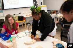 Ivory McCormick, a kindergarten teacher from Atlanta, credits her school’s decision to hire a math specialist last year with helping change how she feels about teaching the subject. (Camilla Forte/The Hechinger Report via AP)