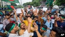 FILE - Hindus hold a rally condemning violence against them and other religious groups, in Dhaka, Bangladesh, on Aug. 12, 2024.