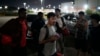 FILE - Hayatullah Omagh, of Afghanistan, and other migrants who were held in a Panamanian deportee camp after being deported from the U.S. arrive in Panama City, March 8, 2025.