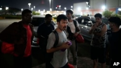 FILE - Hayatullah Omagh, of Afghanistan, and other migrants who were held in a Panamanian deportee camp after being deported from the U.S. arrive in Panama City, March 8, 2025.