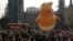 A six-meter high cartoon baby blimp of U.S. President Donald Trump is flown as a protest against his visit, in Parliament Square backdropped by the scaffolded Houses of Parliament and Big Ben in London, England, July 13, 2018. 